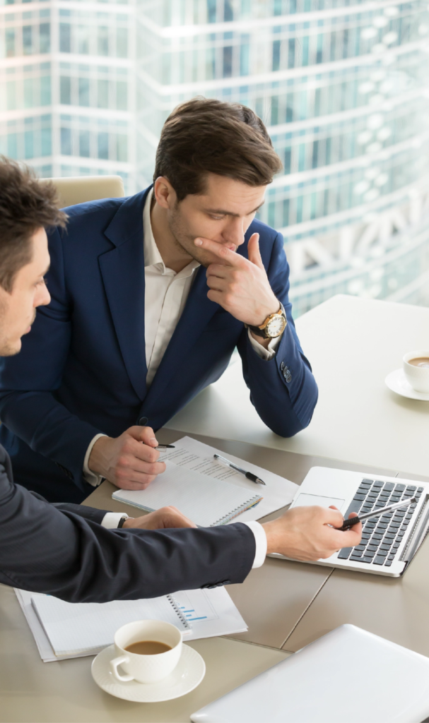Two international students studying together at IAU Madrid, representing modern Business Schools in Spain.