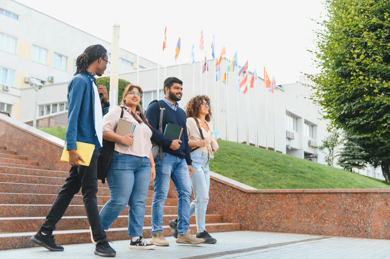 Multicultural group of international students walking on a university campus